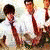 Group of five young men in school uniforms posing together with one holding a guitar, displayed as an animated contact sheet frame.