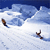 Pixelated static image of two skiers on a snowy slope under blue sky with clouds, rendered in low-resolution 256x256 pixels.