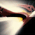 Animated sequence showing a stylized 'S' shield symbol with metallic brown and yellow coloring against a dark background, transitioning from blurred motion to sharp clarity.