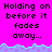 Pixelated text on bright pink background with cyan and purple wave border, repeated three times in top then two times below a gray