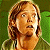 A pixelated contact sheet showing two frames of an animated icon featuring a character with light brown hair and green background on the left, alongside bright green text reading "Original Icons .com" on a dark green background.