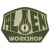 Pixelated icon with dark green and light gray tones showing a stylized figure on a skateboard, set against white background.