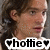Pixelated close-up of a person with brown hair and light skin, wearing dark clothing against a gray background, with text overlay reading 'hotte' flanked by heart symbols.