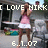 Pixelated image of a person in a pink top and white skirt with text overlays reading "I LOVE NIKK" and "6.1.07".