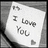 A grayscale pixelated icon shows a white card with 'I Love You' text and a small heart symbol on a dark background.