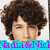 A pixelated image of a person with curly brown hair, featuring overlaid text in multiple colors across the frame.