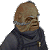 Pixelated character with brown skin and gray headgear on left, green text 'Original Icons .com' on right against dark background.