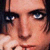 Static 50x50 pixel icon showing a close-up of a person's face with visible eyes, nose, and mouth against dark background.
