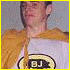 A person in a white shirt with yellow accents appears across showing different poses and expressions