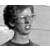 Black-and-white pixelated image with text overlays and a grayscale section, featuring a person's profile on the left side.