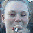A pixelated image split into two sections: a person's face on the left and a no-smoking symbol on the right.