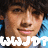 Pixelated close-up of a person with brown hair and light skin, mouth open in a smile showing teeth, against blue background with white text.
