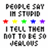 Pixelated text reads "PEOPLE SAY I'M STUPID" above five colored stars, followed by "I TELL THEM NOT TO BE SO JEALOUS" below.