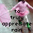 A pixelated image of a person in a pink dress with green shoes, showing text that changes from 'to truly appreciate rain' to 'one must DANCE in it'.