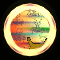 Animated circular icon with glowing yellow border showing a brown cat-like creature and pink figure against sunset background.