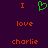 A static pixel art image with a dark purple background displaying orange text and a green heart symbol arranged in three