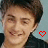 Two side-by-side animated frames of a person with short brown hair wearing a dark shirt, each featuring a red pixelated heart symbol on the right side against a light blue background.