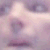 A static image of a stylized face with soft purple and pink tones, featuring blurred facial features and a smooth gradient background.
