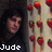 A static image shows a person with dark hair against a background of red strawberries on a light surface, with pixelated text overlays.