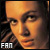 Pixelated close-up of a person's face with warm orange and brown tones, featuring visible text 'FAN' in the bottom-left corner.