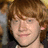 A four- shows a person with red hair and light skin, each displaying different pixelated cyan text overlays