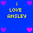 Blue background with yellow text 'i LOVE ANSLEY' and pink/purple pixel hearts in a pattern