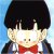 Pixelated character with black hair, red bow tie, and dark jacket against light blue background.