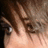 Pixelated close-up of a person's face with brown hair, red text reading 'OMG' and 'GUYLINER!' on black background.