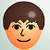 Pixelated cartoon-style face with brown hair, orange skin tone, black eyes and mouth, light blue background.