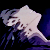 Pixelated jellyfish with white and purple hues against a black background, featuring translucent bell shape and trailing tentacles.