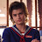 Static 48x48 pixel icon showing a person in a dark blue uniform with red accents against a blurred indoor background.