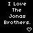 Pixelated text repeatedly states "I Love The Jonas Brothers." with small heart symbols beneath each phrase on a black background.