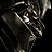 Static 48x48 pixel icon depicting a dark, abstracted mechanical or robotic figure with metallic textures and glowing orange accents against black background.
