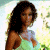 A pixelated contact sheet showing two frames of an animated icon featuring a woman in a light blue dress on the left and green text reading "Original Icons .com" on the right against a dark green background.