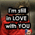 A person in a red shirt holding a blue can, with text overlay reading "I'm still in LOVE with YOU" on the left