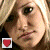 A contact sheet of two animated frames showing a blonde woman's face with red and blue shield icons below each frame on a gray background.