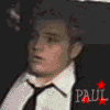 Animated sequence of band members in black shirts and ties with text labels above each frame.