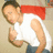 A pixelated image of a person wearing a red and white shirt, dark pants, and making a pointing gesture with their right hand.