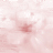 A static pixelated image of a small pink flower with blurred petals on a light pink background.