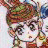 Pixelated image of a character with brown hair, green eyes, and a neutral expression against a light background.