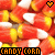 A repeating pattern of candy corn icons with alternating heart symbols, each labeled 'CANDY CORN' in pixelated text.