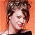 A 50x50 pixel animated buddy icon featuring a split composition with an orange background on the left and green background on the right, containing visible text and a partial portrait of a person.