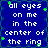 Blue background with white pixelated text reading 'all eyes on me in the center of the ring' repeated four times, green star-like shapes scattered across.