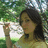 A pixelated image of a person with long dark hair in a yellow top, outdoors with green foliage background, alongside text reading 'ilu virginia ur the best' and 'girlfriend i ever had <3333 7-6-07'.