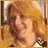 A pixelated animated icon shows a person with light brown hair in motion, wearing a white top and dark checkered shoes against a warm-toned background.