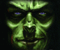 Green-skinned face with glowing blue eyes and a slight smile, displayed in two side-by-side frames showing eye animation.