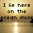 Pixelated text reads 'I lie here broken on the castle by ocean floor the shore' over a golden background with reflective water and dark silhouettes.