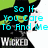 Pixelated image of a character with green hair and black clothing, displaying cyan text that changes between two phrases.