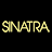 Pixelated black-and-white portrait of a smiling man in a suit with yellow text reading 'SINATRA' on a black background.