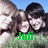 Three people pose outdoors with green grass and blue sky background; green text labels 'Juli', 'Gilla', and 'Nate' appear sequentially over the image.